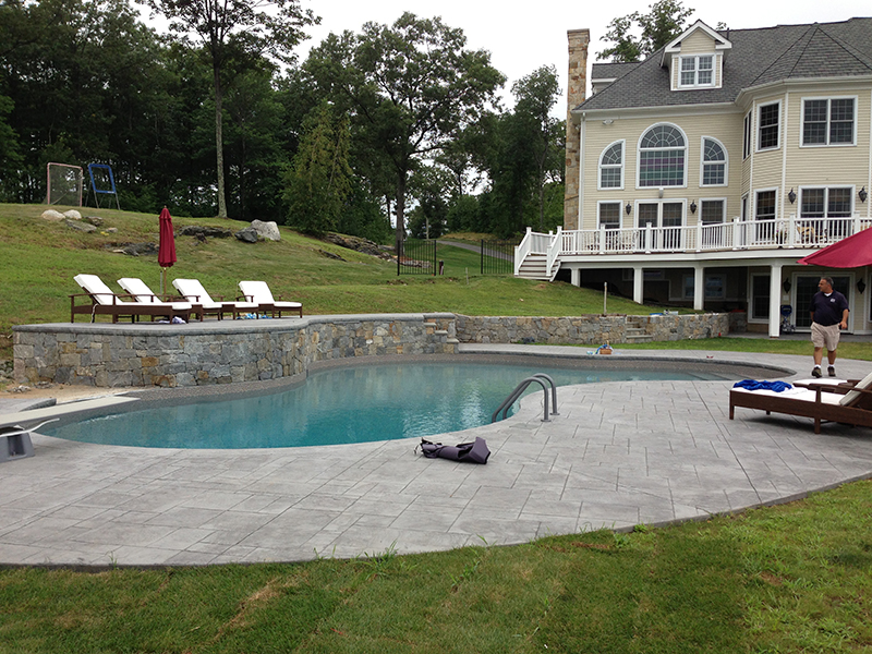 Swimming pool and stamped concrete project example 34